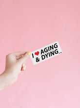 Load image into Gallery viewer, AGING &amp; DYING Bumper Sticker
